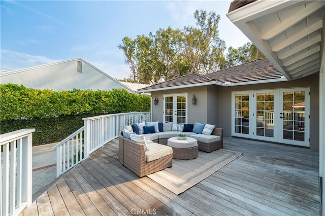 wooden terrace with french doors and outdoor lounge area