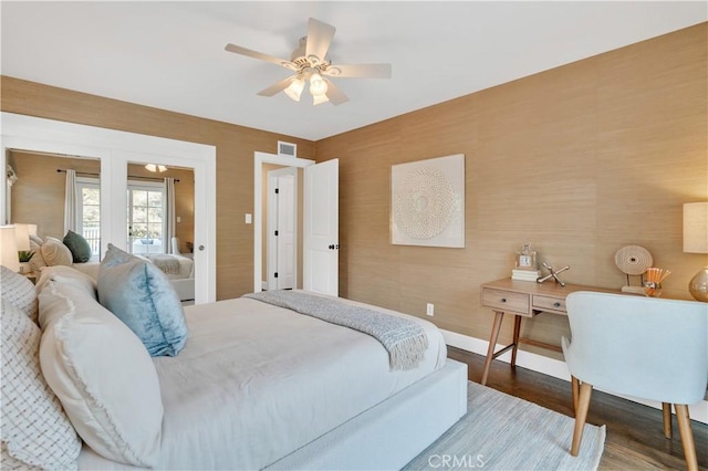 bedroom with ceiling fan and hardwood / wood-style flooring