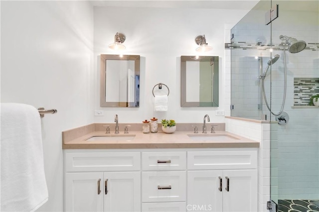 bathroom with an enclosed shower and vanity