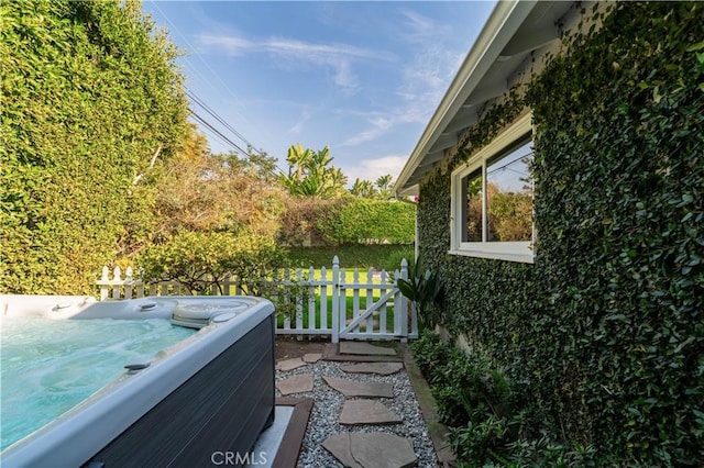 view of patio / terrace featuring a hot tub