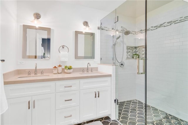 bathroom with walk in shower and vanity