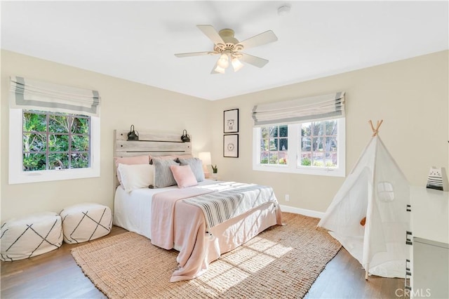 bedroom featuring ceiling fan and hardwood / wood-style flooring