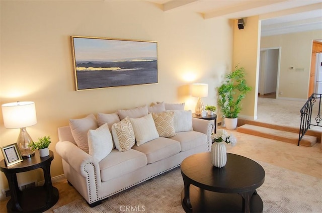 living room featuring carpet and beam ceiling