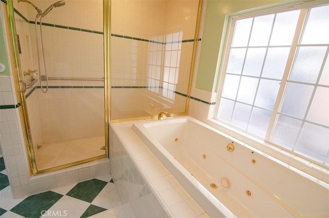 bathroom featuring separate shower and tub