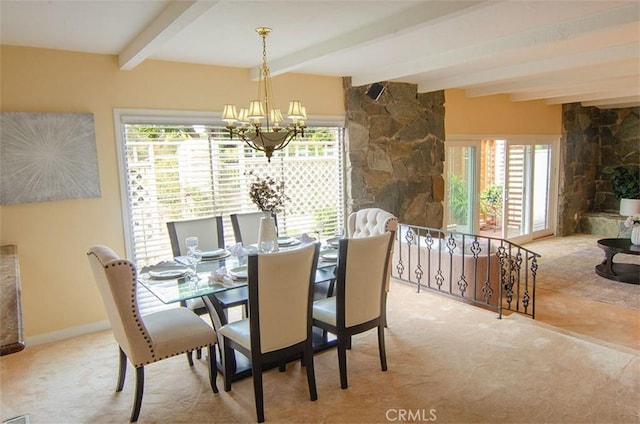 carpeted dining area with beamed ceiling, plenty of natural light, and an inviting chandelier