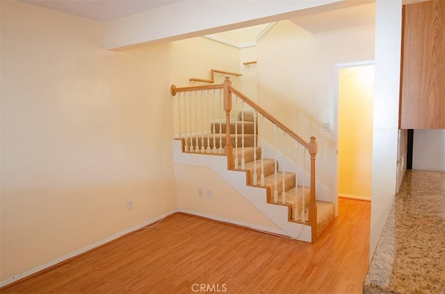 stairway featuring hardwood / wood-style flooring