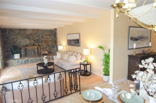 living room with beam ceiling and a stone fireplace