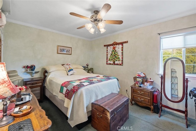 carpeted bedroom featuring ceiling fan and crown molding