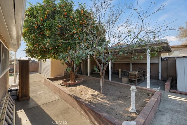 view of side of property featuring a patio area