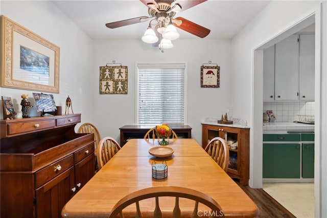 dining area featuring ceiling fan and light wood-type flooring