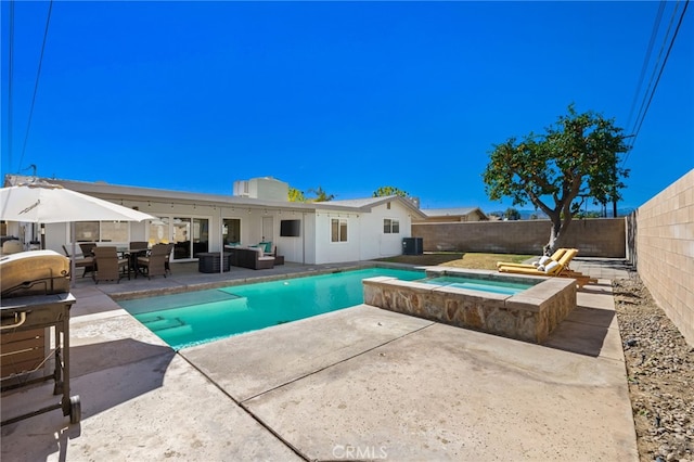 view of swimming pool featuring cooling unit, a patio area, and an in ground hot tub