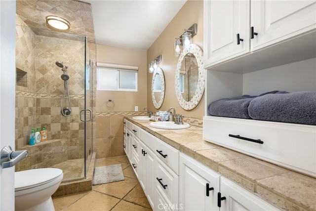 bathroom with toilet, walk in shower, and vanity