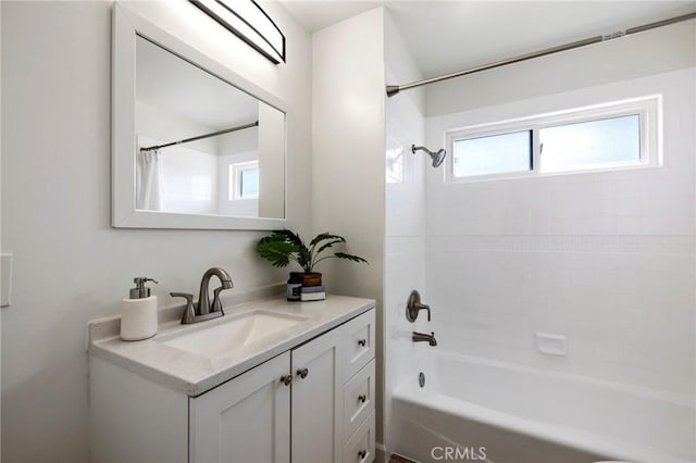 bathroom with vanity and bathtub / shower combination