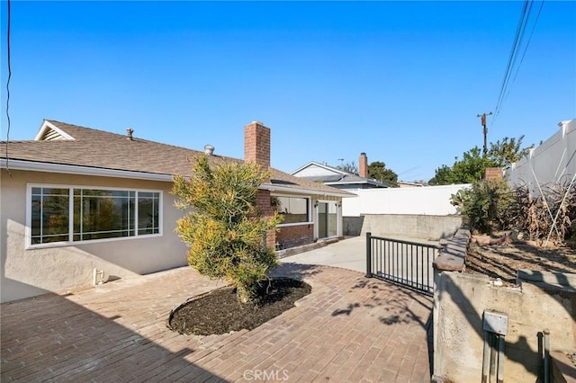 rear view of house with a patio area