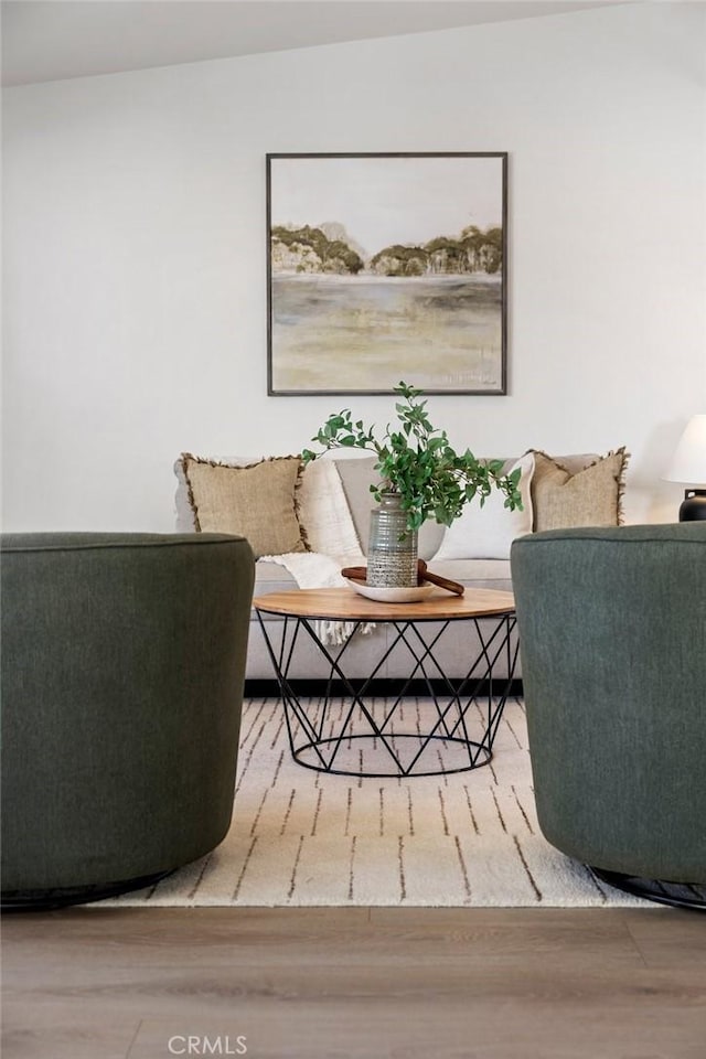 living area with hardwood / wood-style flooring