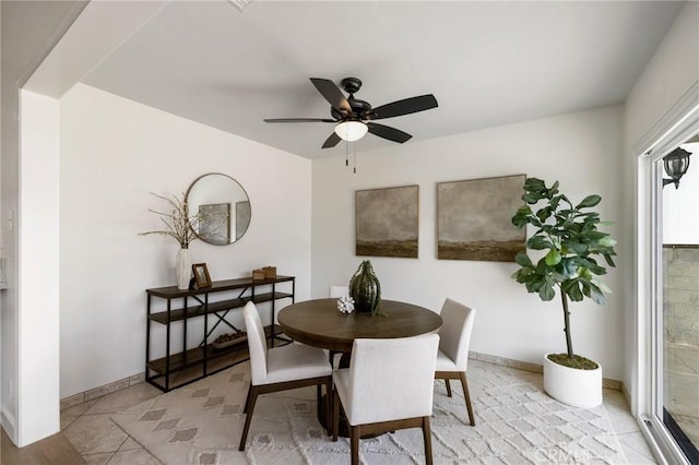 dining space with ceiling fan