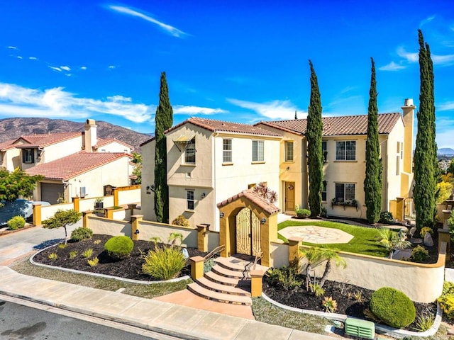 mediterranean / spanish house with a mountain view