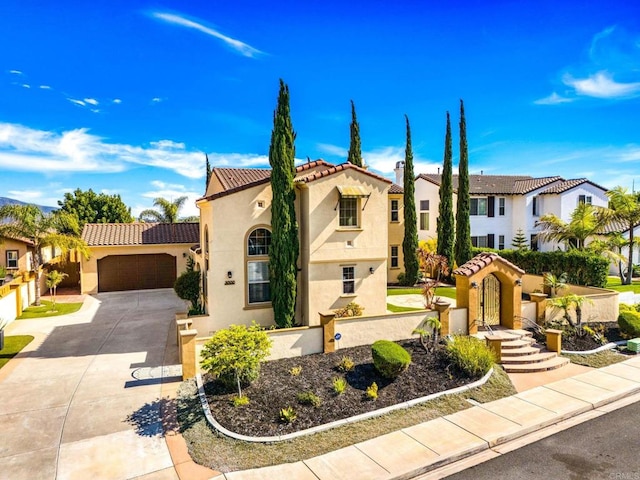 mediterranean / spanish home featuring a garage