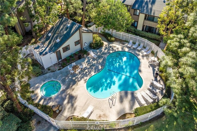 view of pool with a community hot tub and a patio area