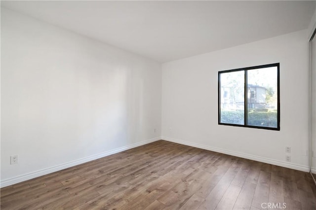 spare room featuring hardwood / wood-style floors