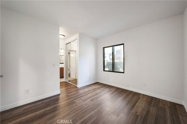 spare room featuring dark hardwood / wood-style floors