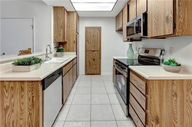 20702 El Toro Rd Unit 359, Lake Forest, CA 92630 - kitchen with a sink, light countertops, stainless steel appliances, and light tile patterned flooring