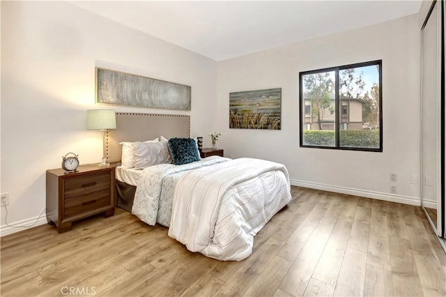 20702 El Toro Rd Unit 359, Lake Forest, CA 92630 - bedroom with light wood-style floors and baseboards