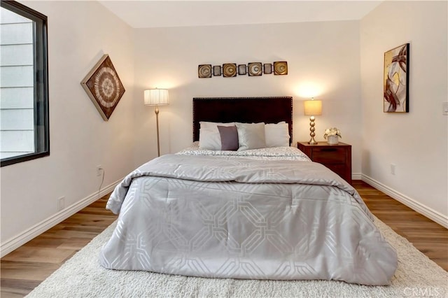 bedroom featuring wood-type flooring