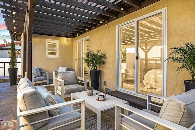 view of patio featuring a pergola and outdoor lounge area