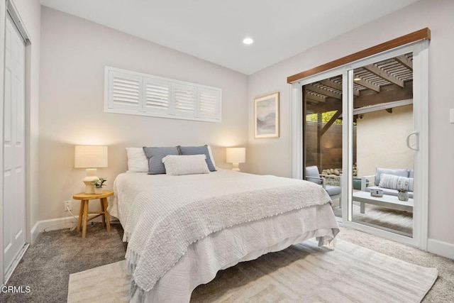 carpeted bedroom featuring a closet and access to exterior