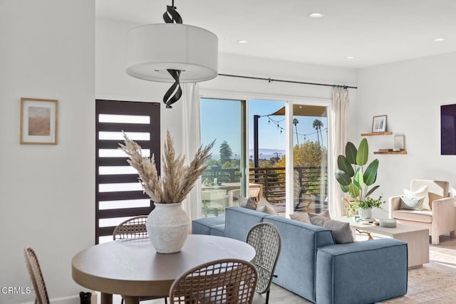 dining area featuring light wood-type flooring