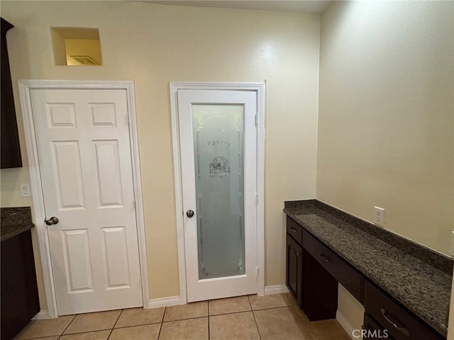 bathroom with tile patterned floors