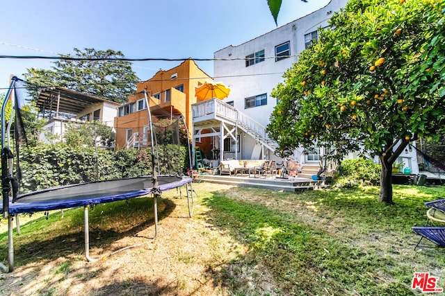 view of yard with a trampoline