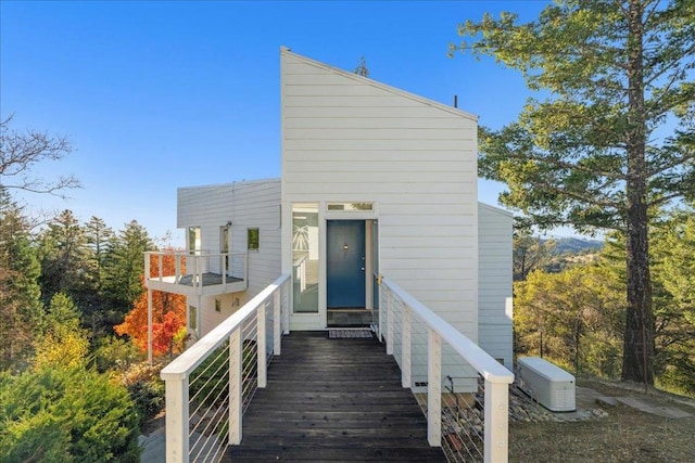 rear view of property featuring a balcony