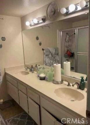 bathroom with vanity and walk in shower