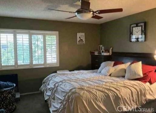 bedroom featuring ceiling fan