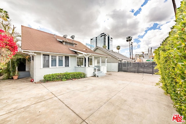 back of property featuring a patio