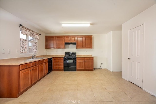 kitchen featuring light tile patterned floors, sink, and black gas range