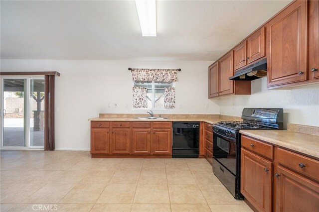 kitchen featuring sink, plenty of natural light, and black appliances