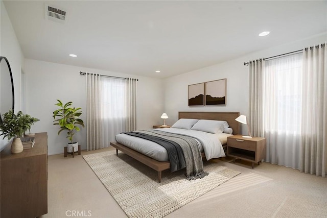 bedroom featuring light colored carpet