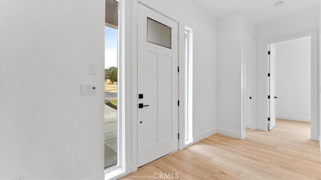 foyer with light wood-type flooring