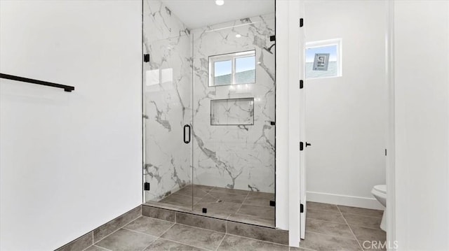 bathroom featuring toilet, tile patterned floors, and walk in shower