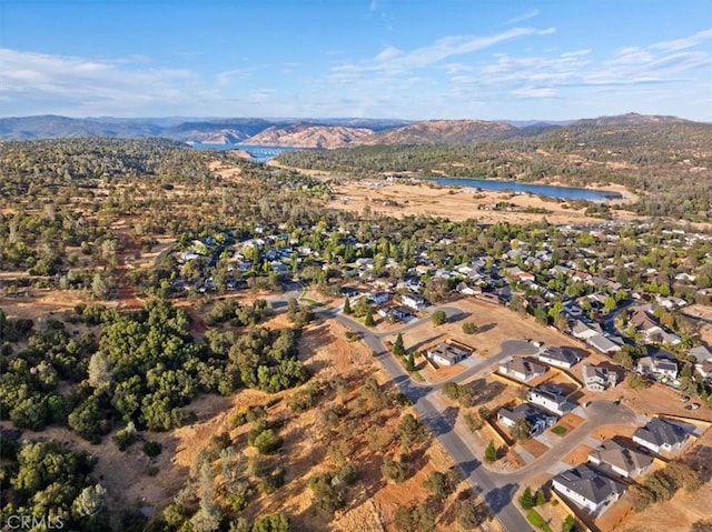 aerial view featuring a water and mountain view