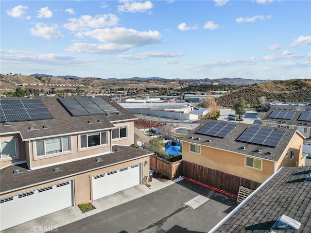 birds eye view of property featuring a mountain view