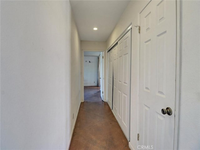 corridor with dark tile patterned floors