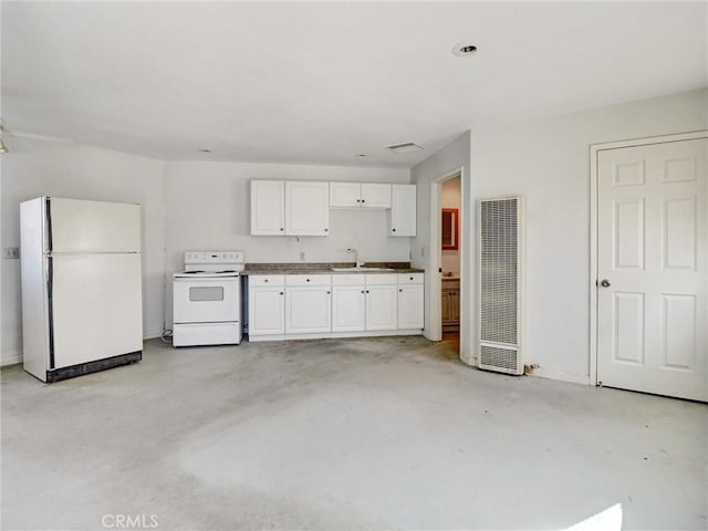 kitchen with sink, white appliances, and white cabinets