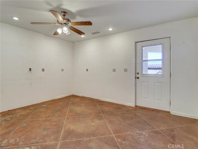 spare room featuring ceiling fan and tile patterned flooring