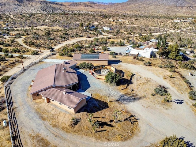 birds eye view of property featuring a mountain view