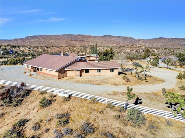 birds eye view of property featuring a mountain view