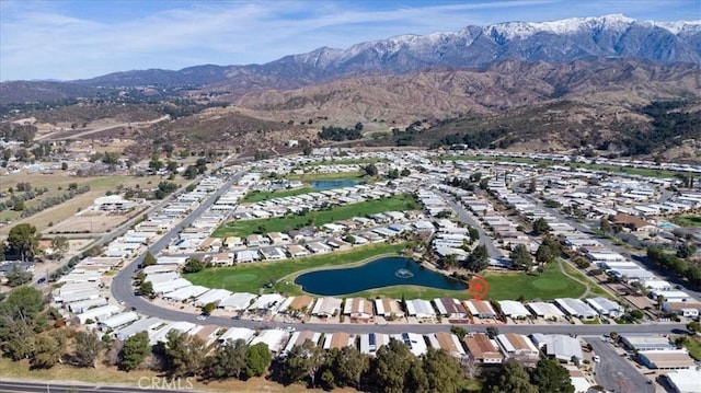 drone / aerial view with a residential view and a water and mountain view